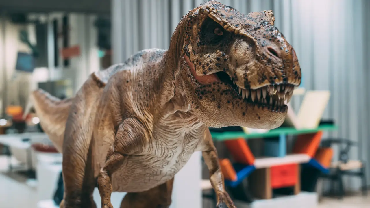 Illustration of dinosaur, animals, and reptiles in a natural setting.