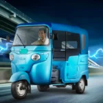 Electric Bajaj GOGO three-wheeler showcasing modern design and eco-friendly features.