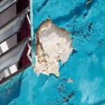 Building with visible cracks due to heatwave stress