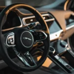 Vintage Jaguar steering wheel with logo on the center.