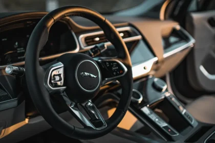 Vintage Jaguar steering wheel with logo on the center.