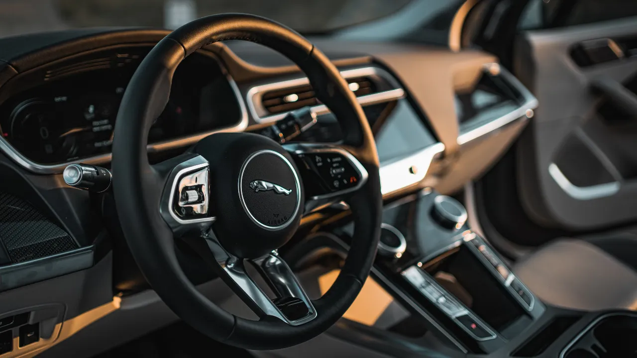 Vintage Jaguar steering wheel with logo on the center.