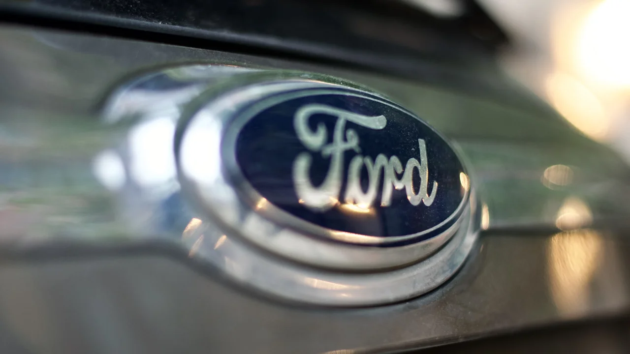 Ford logo on a grey car bumper showcasing branding and design.