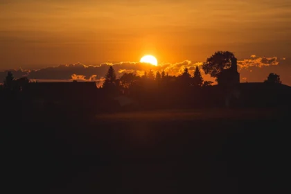 Sunset scene during golden hour with warm, glowing sky.