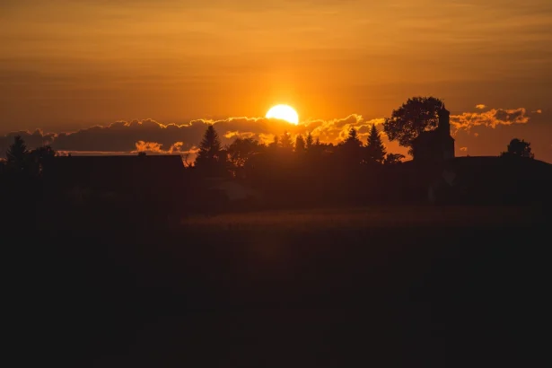 Sunset scene during golden hour with warm, glowing sky.