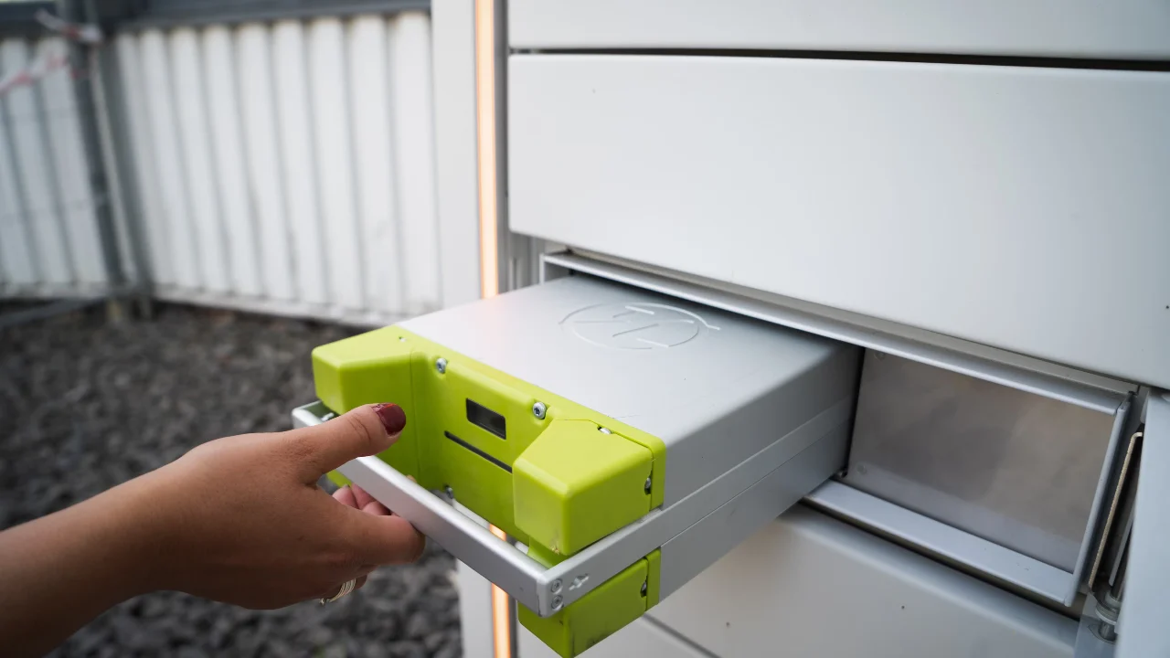 Colorful illustration of a green-and-white EV battery.