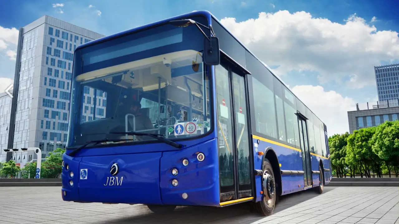 Electric bus labeled JBM ECO-LIFE promoting zero emissions in India.