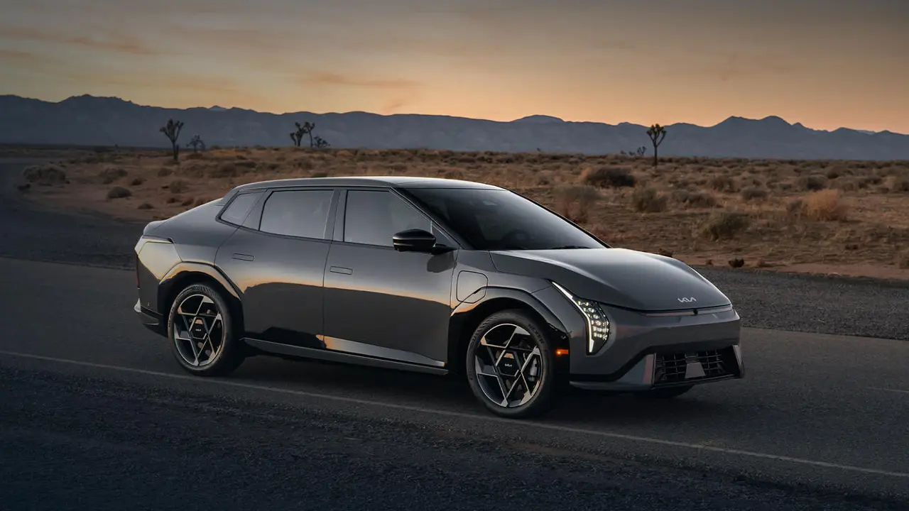 Kia EV4 electric car with US flag, highlighting import and tax challenges.