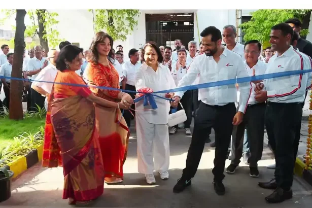 Kinetic Group's electric vehicle factory with robots and computer systems in Maharashtra.