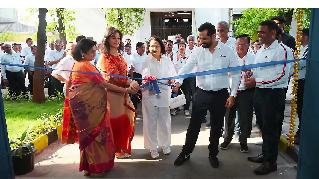 Kinetic Group's electric vehicle factory with robots and computer systems in Maharashtra.