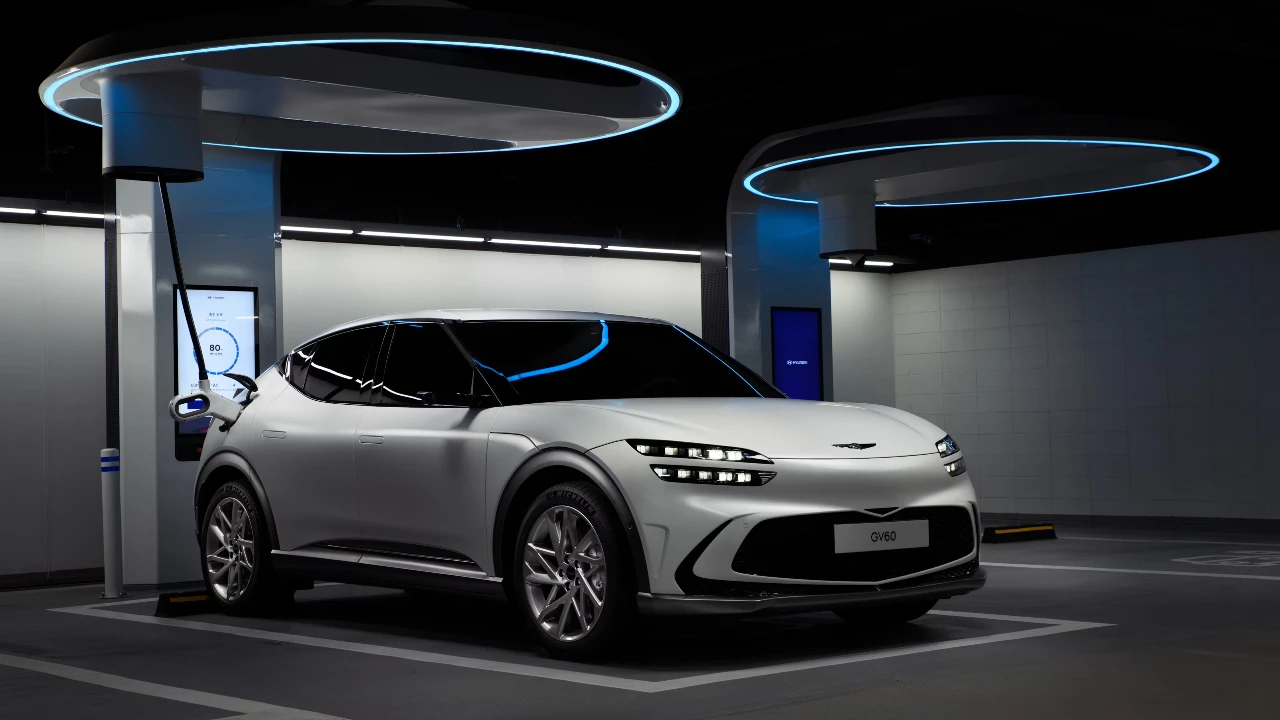 White sports car charging at a modern EV station, eco-friendly transportation