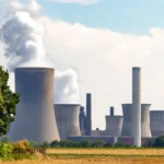 Nuclear power plant with pollution-emitting chimneys