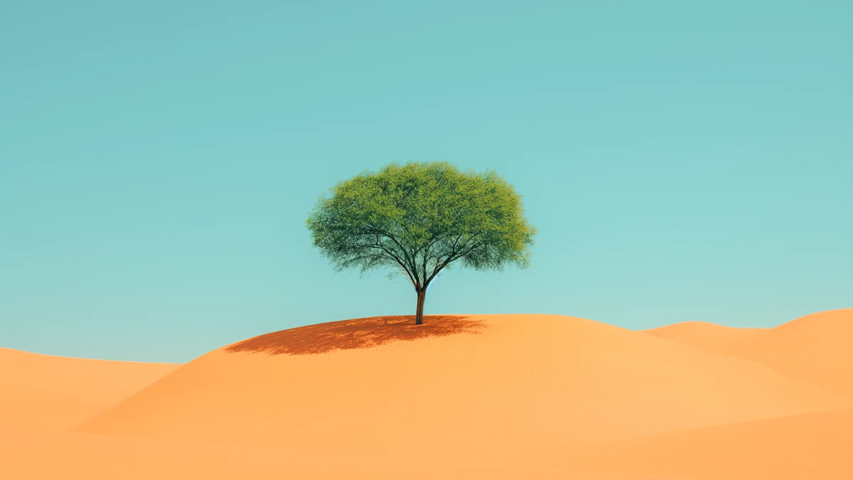 Green tree alone on golden sand dune under blue sky in desert