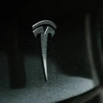 Tesla electric car with logo and Elon Musk, electric vehicle innovation.