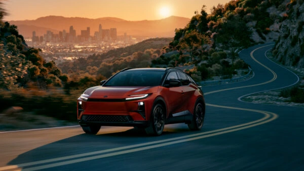 Toyota C-HR BEV electric SUV with spacious interior and advanced safety in a modern setting.
