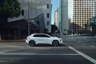 Toyota 2026 bZ Electric SUV with safety and charging features in urban setting.