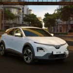 Vietnamese VinFast VF6 white compact SUV showcasing modern design and tech features.