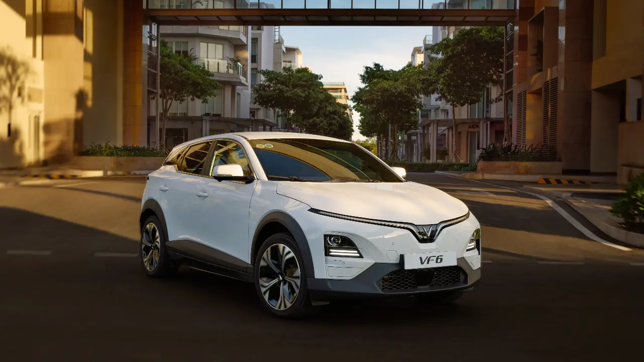 Vietnamese VinFast VF6 white compact SUV showcasing modern design and tech features.