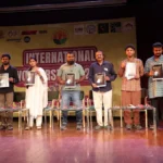 Workers from South Asia protesting for climate justice during Labour Day with signs and banners.
