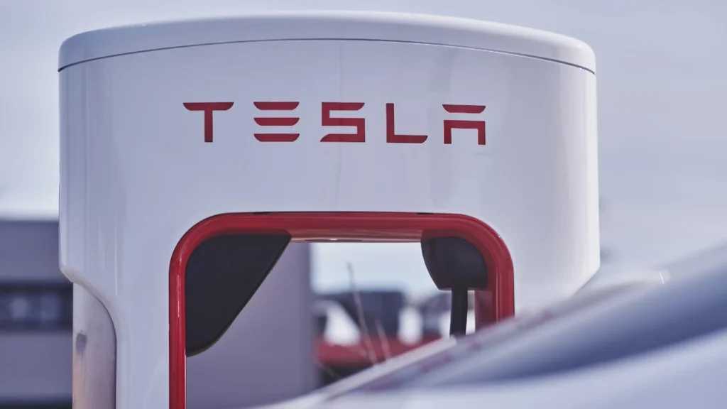 Close-up of a modern white and red Tesla gas station.